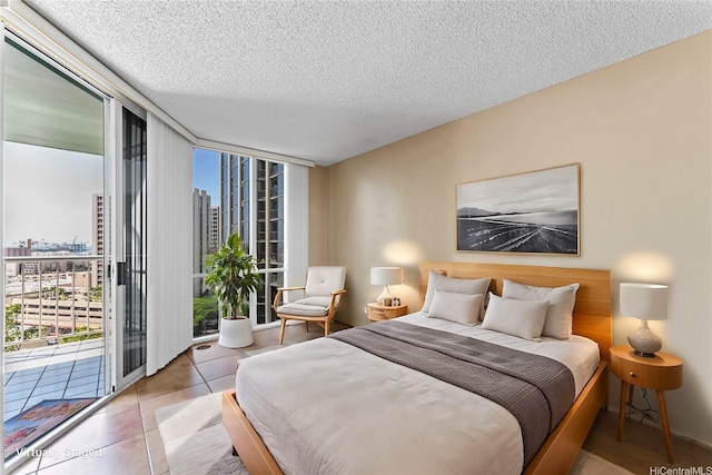 1212 Nuuanu Ave Unit 1412, Honolulu, HI 96817 - tiled bedroom with a view of city, access to exterior, a textured ceiling, and expansive windows