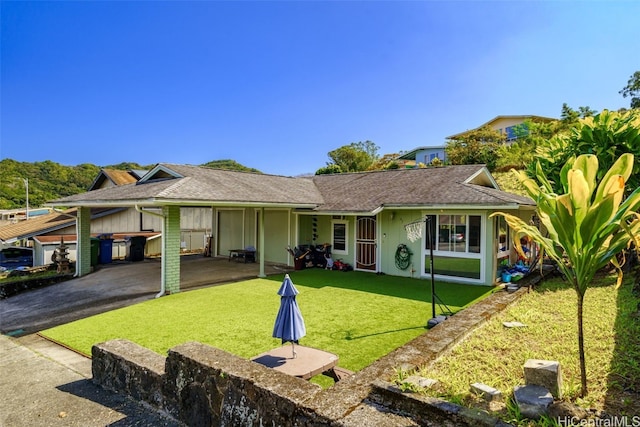 ranch-style home with a front lawn