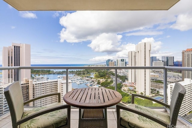 balcony featuring a water view