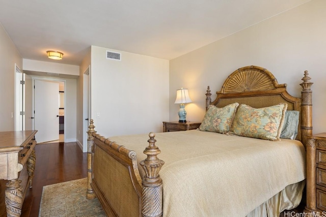 bedroom featuring dark hardwood / wood-style floors