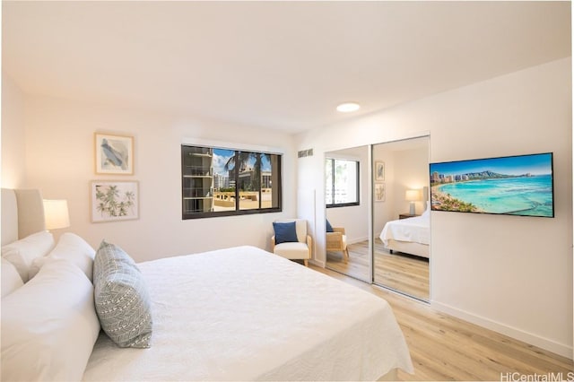 bedroom with a closet and light wood-type flooring