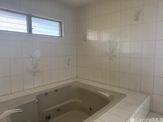 full bathroom featuring a jetted tub and tile walls