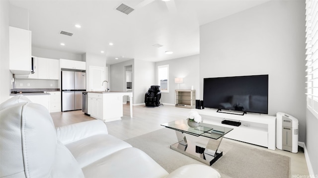 91-2220 Kaiwawalo St Unit 5501, Ewa Beach, HI 96706 - living area featuring visible vents, baseboards, recessed lighting, and light wood-style floors