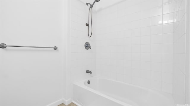 91-2220 Kaiwawalo St Unit 5501, Ewa Beach, HI 96706 - bathroom featuring baseboards and bathtub / shower combination