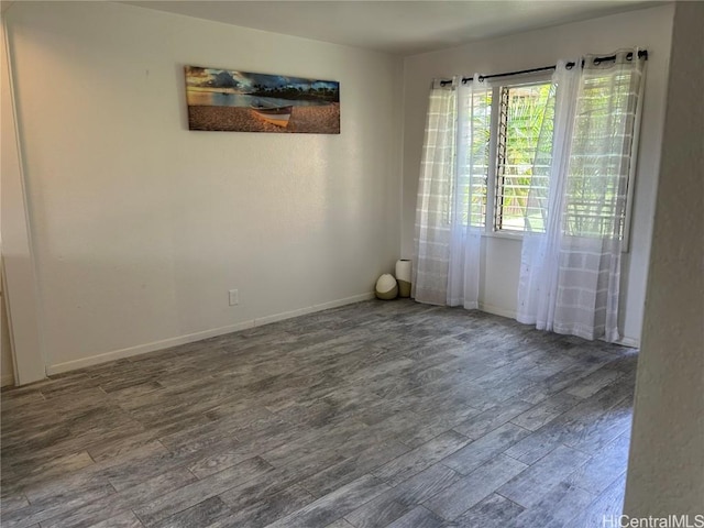 unfurnished room featuring hardwood / wood-style floors