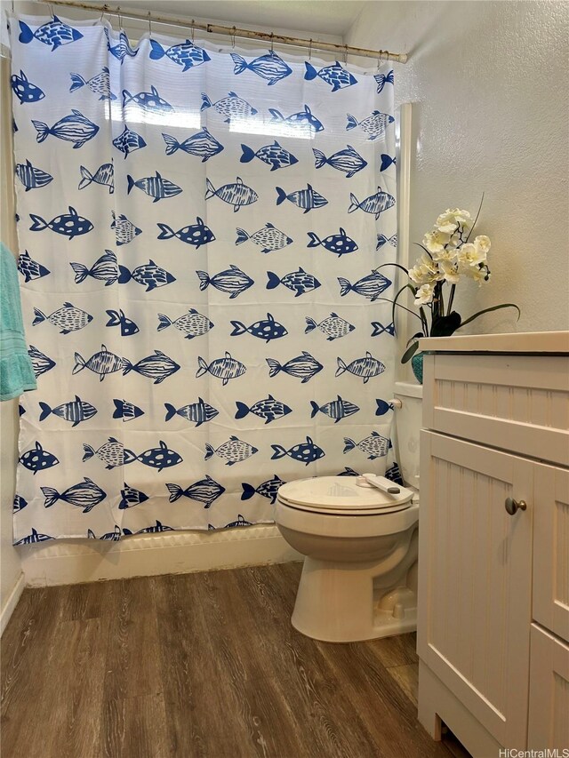 98-1385 Hinu Pl Unit 77, Pearl City, HI 96782 - bathroom featuring wood finished floors, toilet, vanity, and baseboards