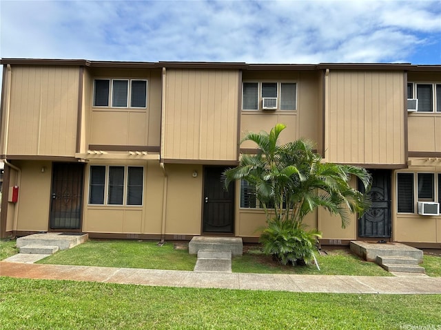 98-1385 Hinu Pl Unit 77, Pearl City, HI 96782 - townhome / multi-family property featuring a front yard and cooling unit