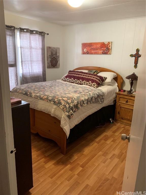 bedroom with light hardwood / wood-style flooring
