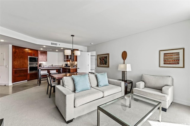 living room featuring light colored carpet