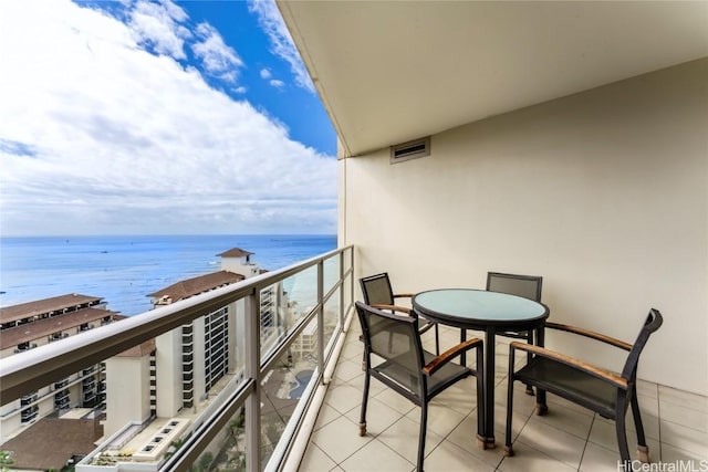 balcony featuring a water view