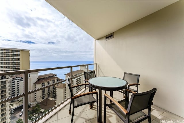 balcony featuring a water view