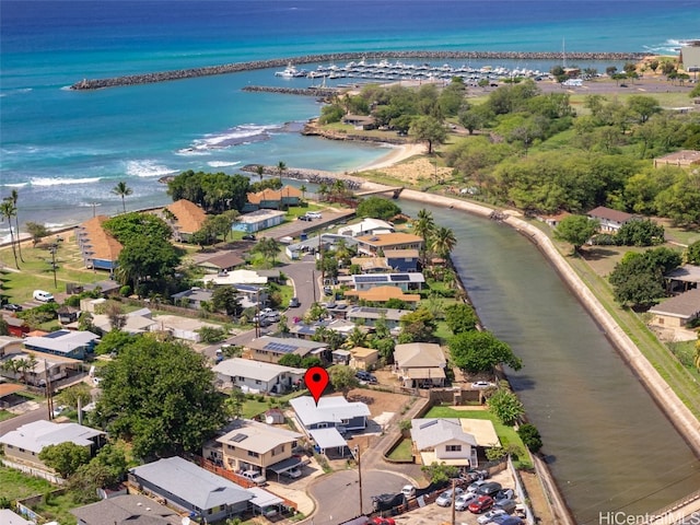 birds eye view of property with a residential view and a water view