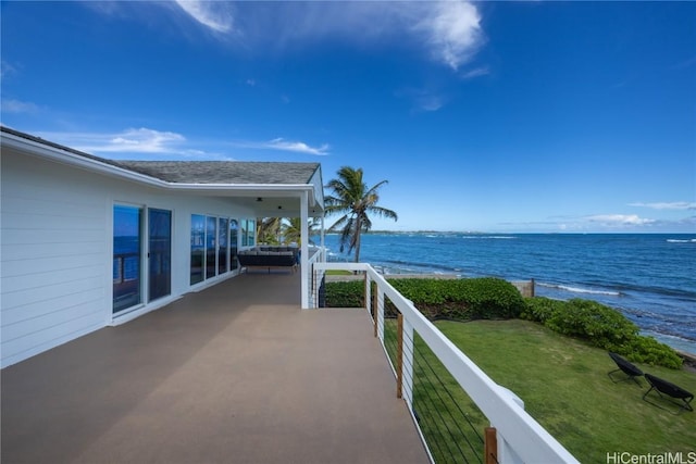 view of patio featuring a water view