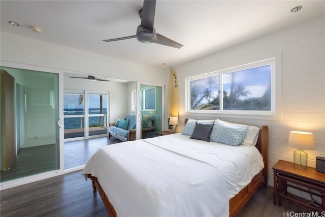 bedroom with ceiling fan, dark wood-style flooring, multiple windows, and access to exterior