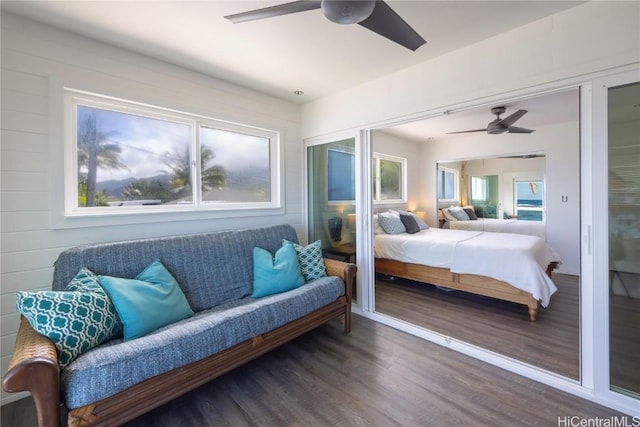 bedroom featuring ceiling fan, a closet, and wood finished floors