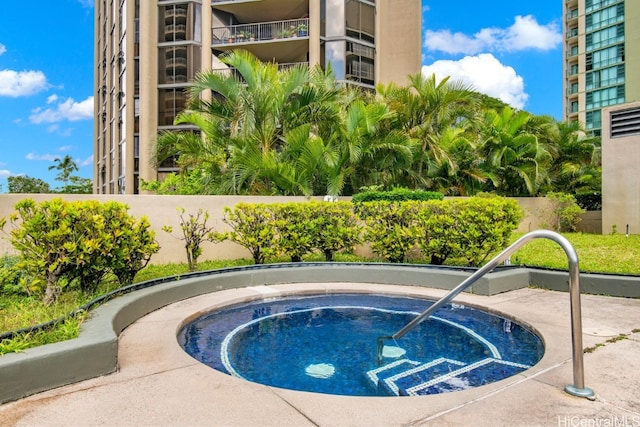 view of swimming pool featuring a community hot tub