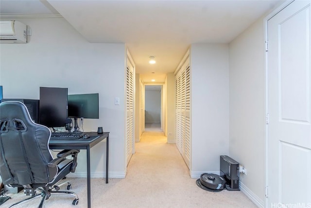 office with a wall mounted air conditioner, baseboards, and light colored carpet