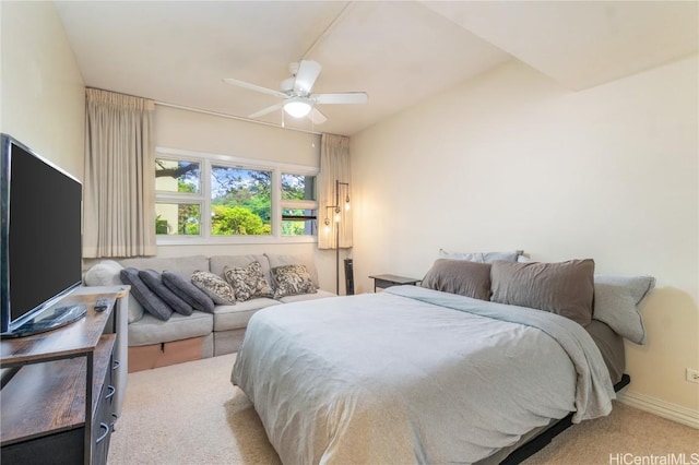 carpeted bedroom featuring ceiling fan and baseboards