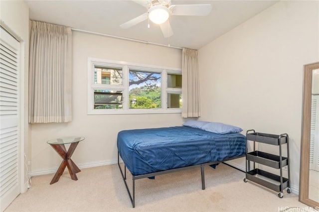 bedroom with carpet floors, ceiling fan, and baseboards