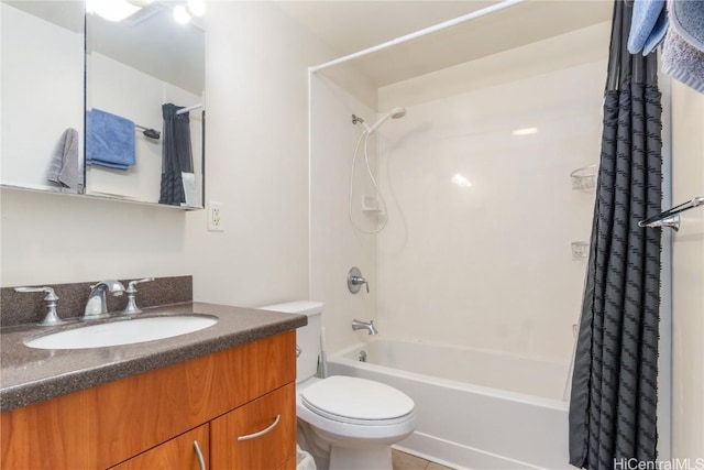 bathroom with vanity, toilet, and shower / tub combo with curtain