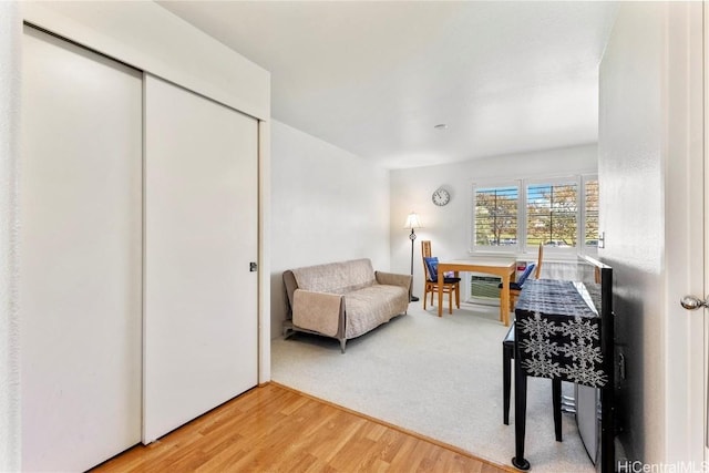 sitting room with hardwood / wood-style flooring