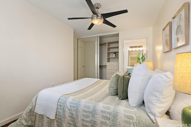 bedroom with a ceiling fan, baseboards, and a closet