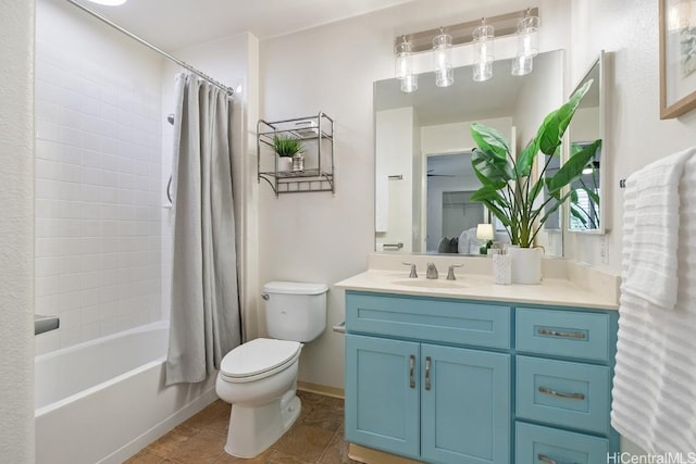 bathroom featuring toilet, shower / tub combo, vanity, baseboards, and tile patterned floors