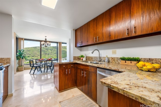 kitchen featuring sink, dishwasher, floor to ceiling windows, a notable chandelier, and decorative light fixtures