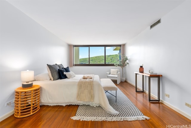 bedroom featuring hardwood / wood-style floors