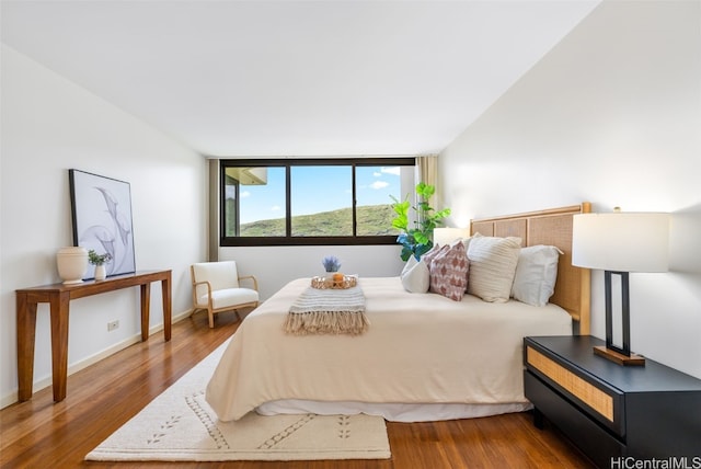 bedroom with wood-type flooring