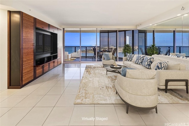 living room featuring light tile patterned flooring and floor to ceiling windows