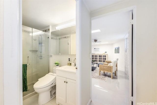 bathroom featuring vanity, walk in shower, ceiling fan, and toilet