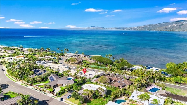 drone / aerial view with a water and mountain view