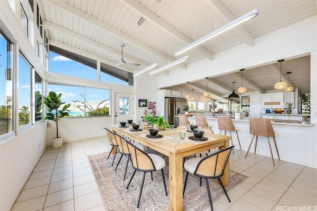 dining space with beamed ceiling, wooden ceiling, high vaulted ceiling, and light tile patterned floors