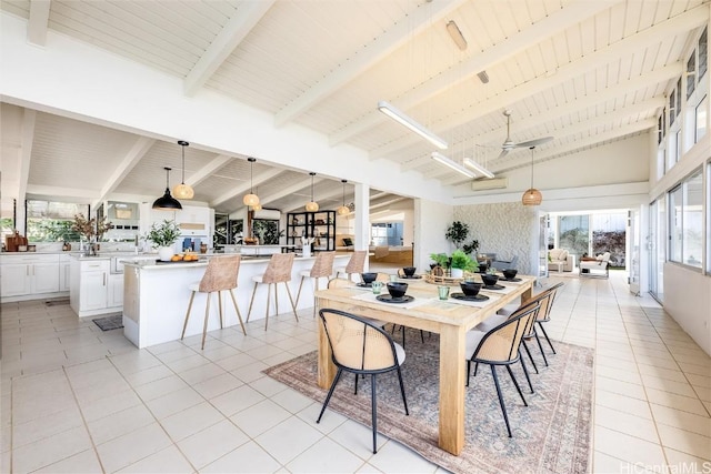 dining space featuring high vaulted ceiling, light tile patterned floors, wooden ceiling, and beam ceiling