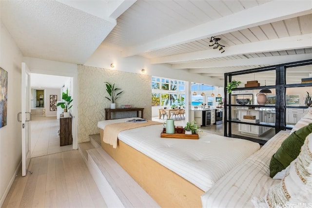 bedroom featuring wood ceiling, beam ceiling, and hardwood / wood-style flooring