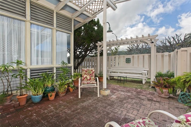 view of patio / terrace featuring fence and a pergola