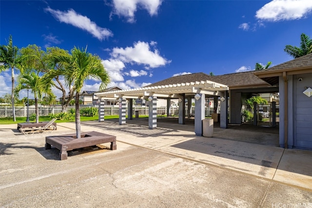 surrounding community featuring a pergola, a patio, and fence