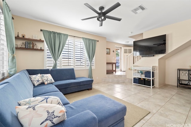 living room with visible vents, ceiling fan, and tile patterned flooring