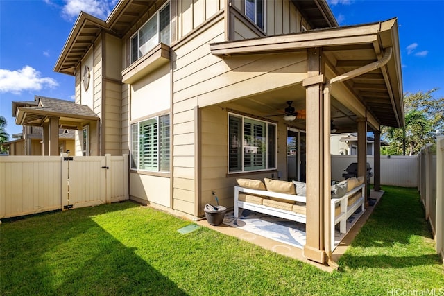 view of home's exterior with a ceiling fan, a yard, a fenced backyard, a patio area, and an outdoor hangout area