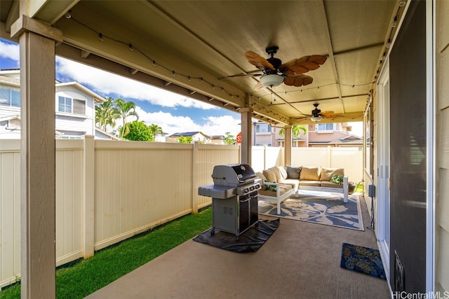 view of patio featuring grilling area, an outdoor hangout area, a ceiling fan, and a fenced backyard