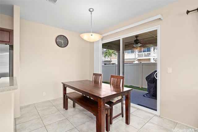 dining room with light tile patterned flooring and a ceiling fan