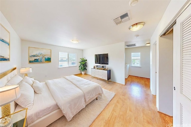 bedroom with light hardwood / wood-style floors