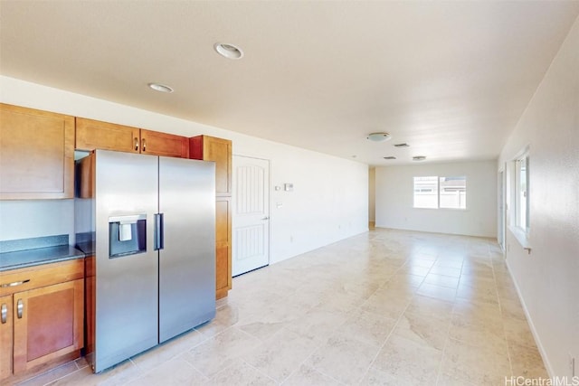 kitchen featuring stainless steel fridge