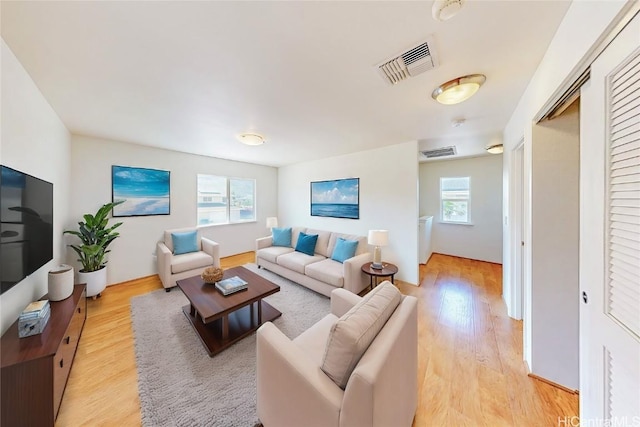 living room with light hardwood / wood-style floors