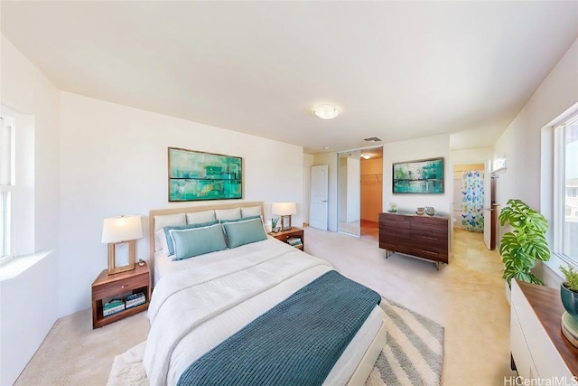 bedroom with light colored carpet