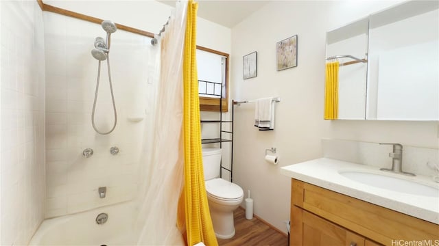 full bathroom featuring vanity, wood-type flooring, shower / bath combination with curtain, and toilet