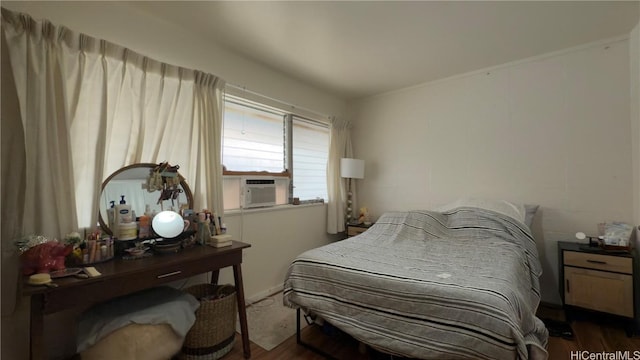 bedroom featuring dark hardwood / wood-style floors and cooling unit