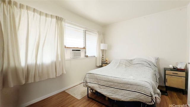 bedroom with dark wood-type flooring and cooling unit