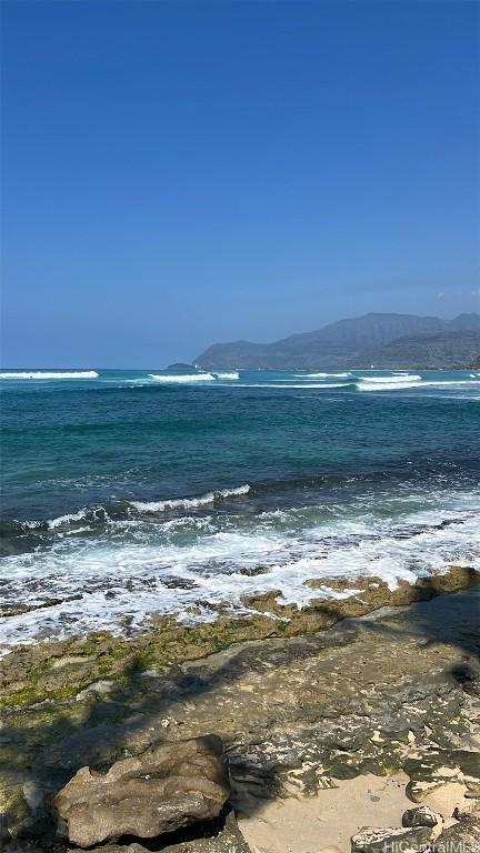 property view of water with a mountain view and a beach view